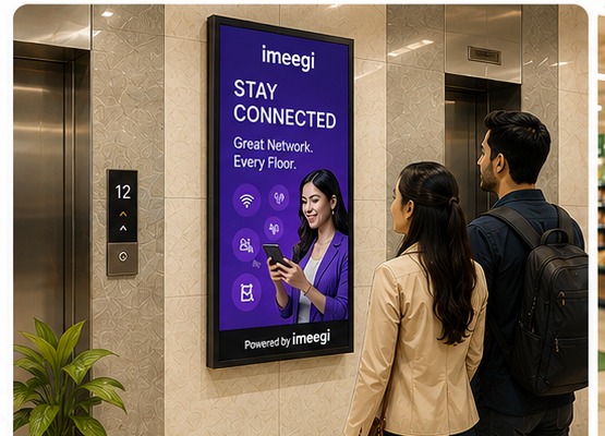 Digital screen advertising display beside a lift lobby entrance